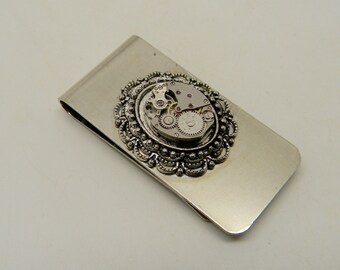 Steampunk jewelry money clip with watch movement.