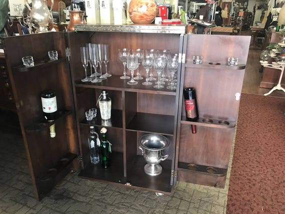Fold away bar cabinet