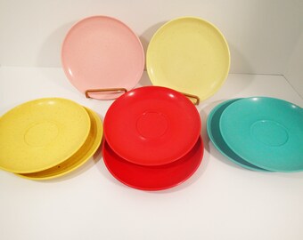 Speckle ware vintage melmac melamine Holiday Kenro saucers bright orange, yellow. and turquoise. Pink and yellow speckle ware bread plates