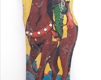 1950's Tinplate whistle with lithograph of a cowboy on his horse. Made in Japan.
