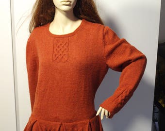 Celtic sweater with pleated peplum.