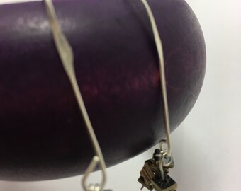 Stacked gold and silver earrings
