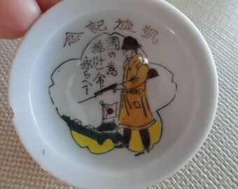 D028) Antique Japanese Military WWII Sake Cup with airplane base