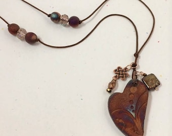 Ceramic heart with accent charms on cord