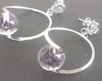 Spun on hoops swirling glass beads