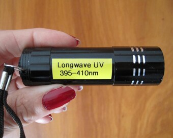 Long wave UV (blacklight) flashlight is a rock hound necessity. Includes two small fluorescing stones. Durable Aluminum 9 led ready to go.
