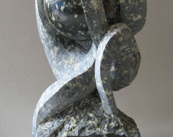Green serpentine sculpture. "Torment"
