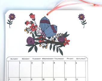 2018 Wall Calendar, 5.5x8.5 inches featuring 12 different illustrations in gray, orange, purple, mustard, green, fuchsia and brown