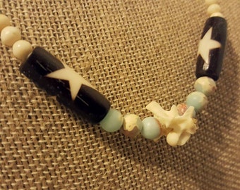 Snake vertebrae necklace with bone, ocean jasper, basalt, and Czech glass beads