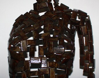 Bust woman steel, oxidized and varnished.