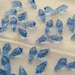 12 pieces Swarovski #6000 13x6.5mm Crystal Light Sapphire Teardrop Faceted Pendant Beads
