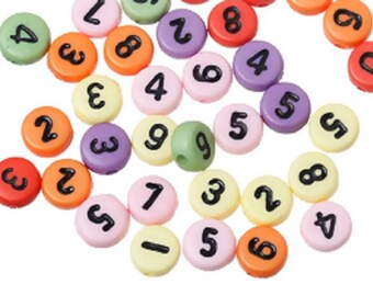 100 multicolored round beads with 7mm black figure