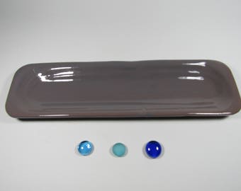 Grey ceramic spoon rest fired.
