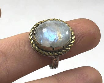SIMPLE MOONSTONE RING: Sterling silver and brass, featuring a Rainbow Moonstone