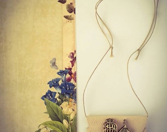 A Leather Pendant with Wood Birdcage details.
