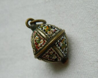 Small copper ball decorated with micro mosaic.
