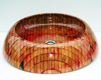 Nipigon round bathroom sink. Exotic wooden sink design