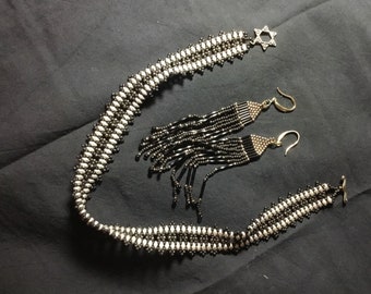 Black and silver choker with matching earrings.