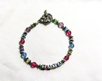 Multi-color swarovski and sterling silver name bracelet.