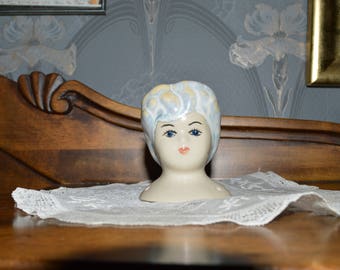 Ceramic doll head.