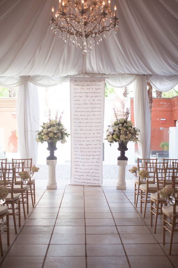 Handwritten calligraphy style wedding ceremony backdrop aisle