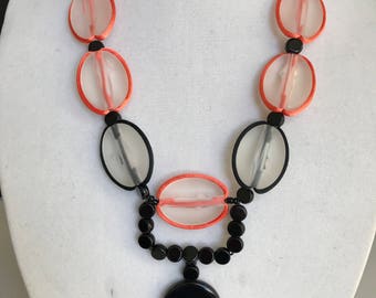 A happy black, white, and orange necklace