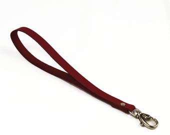 Burgundy leather with snap strap