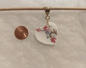 Heart shaped broken china pendant.