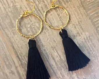 Black silky tassle earrings with gold hammered rings. Black tassel earrings