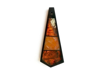 Pendant of amber and Gagat in abstract style