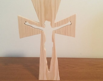 A wooden crucifix with Jesus cutout.