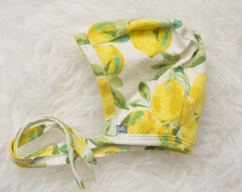 lemon print pilot hat by Little Lapsi. Baby hat with ties.