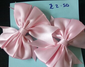 Pale pink bow hair grips