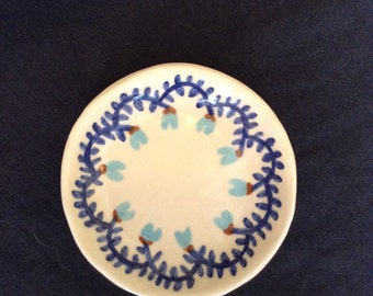 Handmade porcelain ring or trinket dish with painted flowers