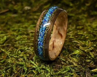 Masur Birch and Walnut Bent Wood Ring with a center inlay of Blue Bird Azurite Chrysocolla with two bands of gold Chalcopyrite on the sides.