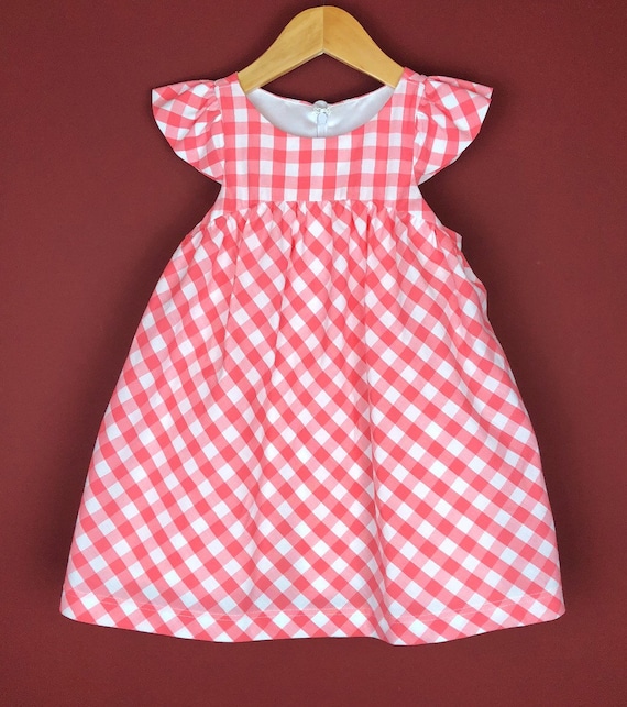 The "Flutter-By Dress" in Salmon Gingham.