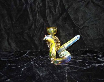 Hand blown glass cobra pipe.