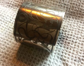 White metal napkin ring.