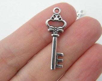 8 Key charms antique silver tone K3