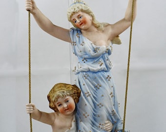 Antique German Bisque Figurines on a Swing