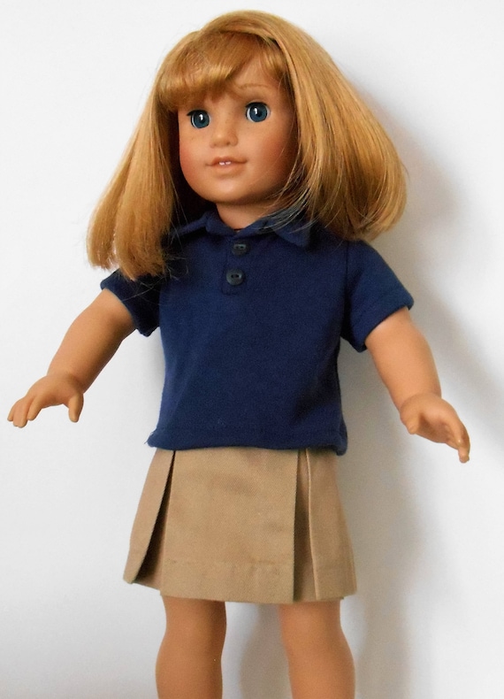 Khaki school uniform skirt with navy blue knit polo shirt fits