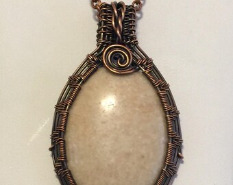 Copper wire wrapped riverstone cabochon
