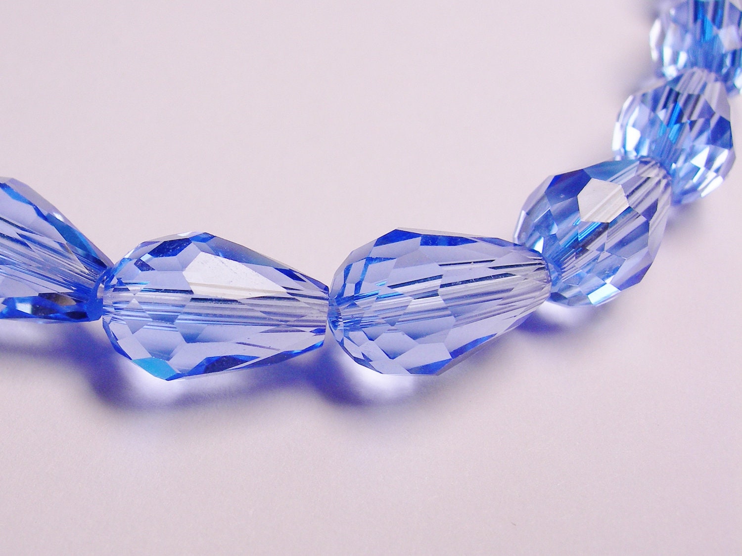 Faceted teardrop crystal beads 20 pcs 11 mm by 7mm clear blue NCBS2