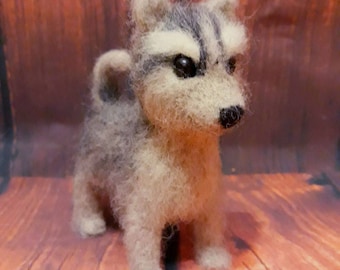 Felting dog. Hand work beautiful, fluffy dog. children can be very pleased.