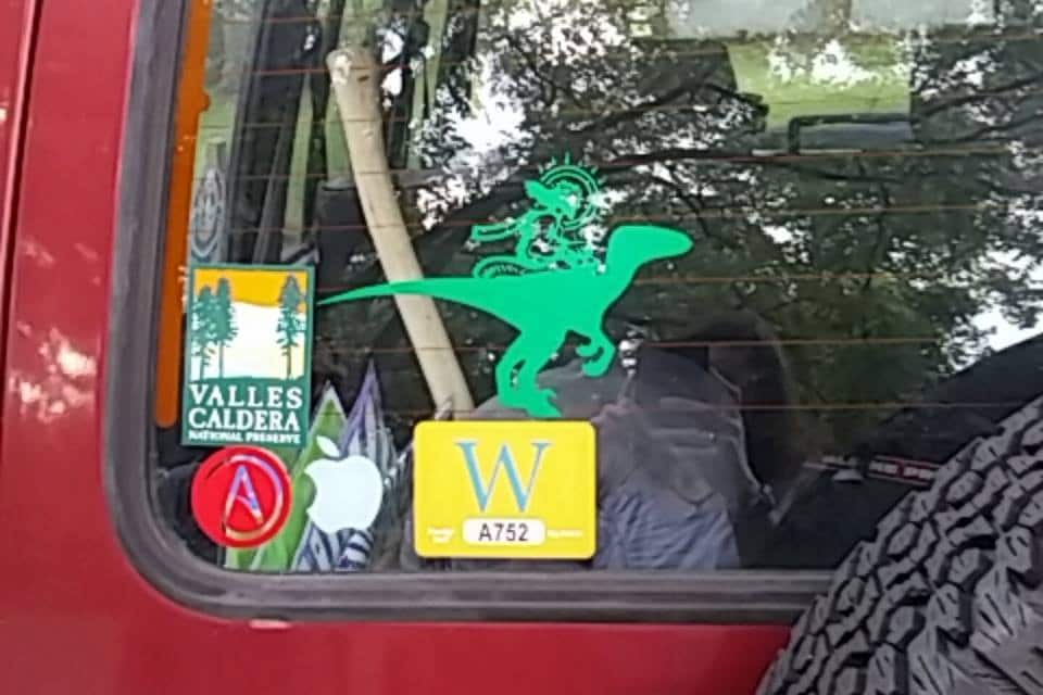 jesus riding a velociraptor