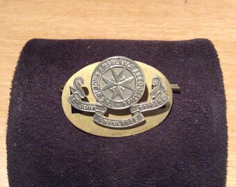 Cap badge for the British St Johns Ambulance Brigade