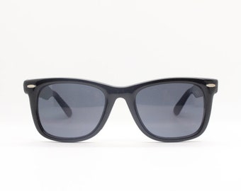 Black wayfarer style vintage sunglasses. Original 80s NOS. All time classic design in quality materials and finish. Made in Italy. BNWT.
