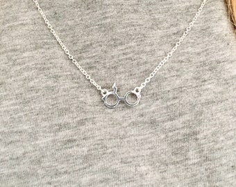 Glasses and Scar Necklace