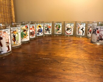 Set of eleven beautiful BP presents Normal Rockwell glasses