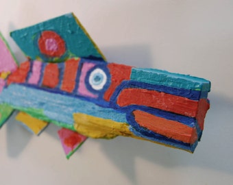 Fish Art Created from from wood found in the woods or on beaches around the world. Each completely unique fish is painted with imagination
